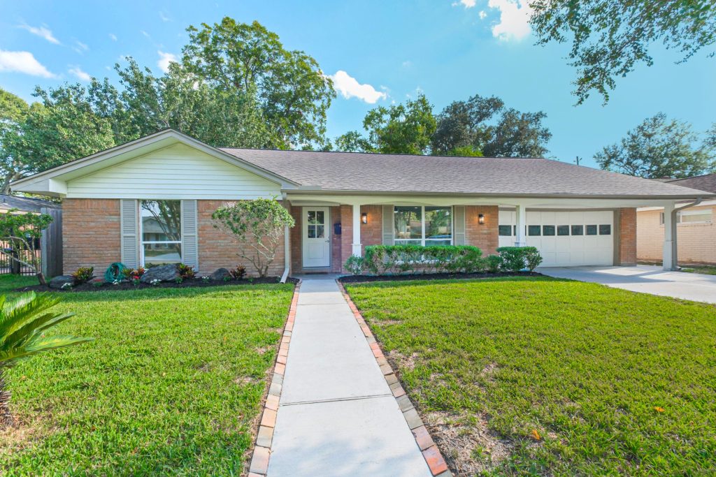 Brick ranch home exterior with new walkway after a Westbury renovation