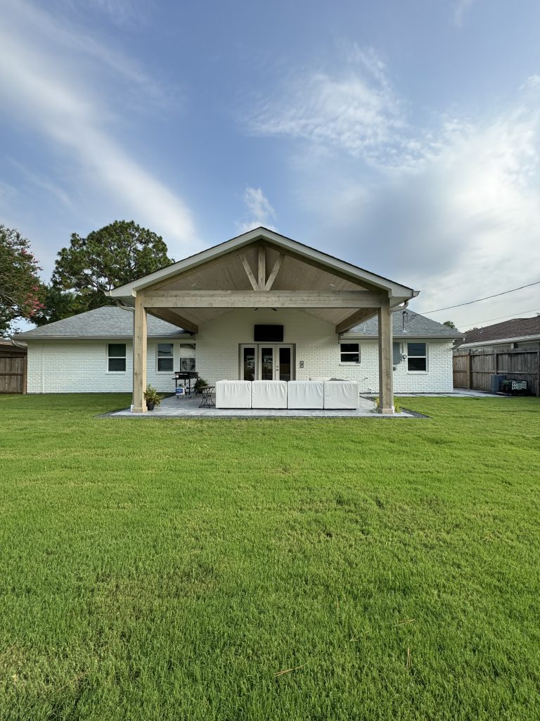Meyerland covered patio addition with cedar beams and stained concrete