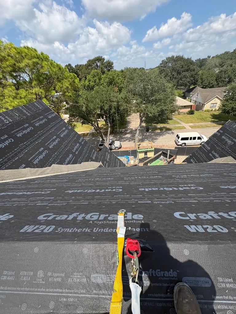 Synthetic roof underlayment installed over the roof deck on a Houston new build