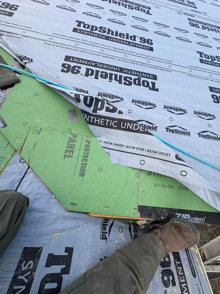 Taped ZIP System sheathing seams checked before siding goes on